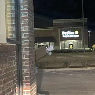 overflowing trash can at the end of the drive through lane (yuck)