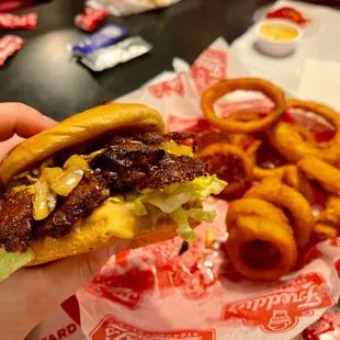 Double steak burger with California style with grilled onions and onion rings