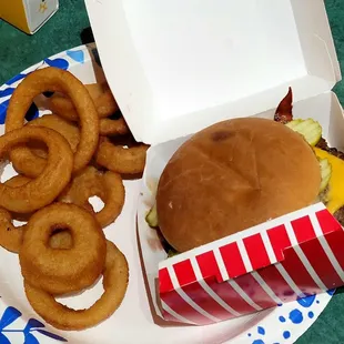 Onion rings with a double cheese and bacon burger. Yum!
