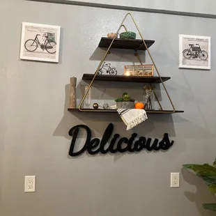 a hanging shelf with a delicious sign