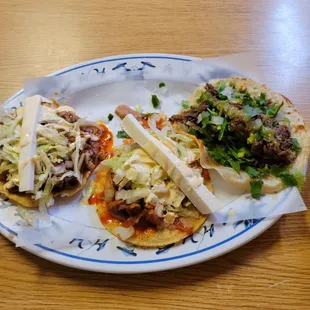 Bistec tostada, AL Pastor Tostada and Barbacoa taco. Just killer flavors