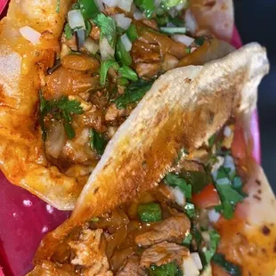 The Al Pastor Tacos are a must get!!! They have pineapple in them and a kick of spice. A must try for sure!