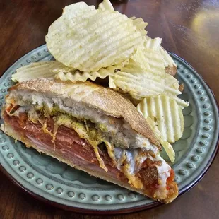 MUFFALETA SANDWICH- Ham, capicolla, pepperoni,  Salame, provolone, house mustard, banana pepper tapenade, olive spread, toasted ciabatta.