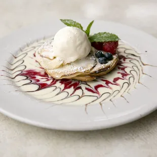 Apple Crepia, thin sliced apples and pastry topped with vanilla ice cream
