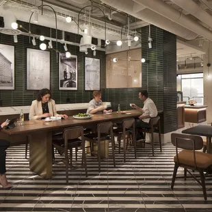 a group of people sitting at tables in a restaurant