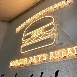 a neon sign for a fast food restaurant