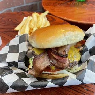 a bacon cheeseburger with fries