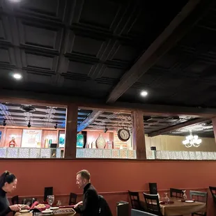 The center divider / ceiling support separates the dining area from the bar