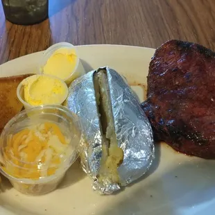 My friend had the steak! It was juicy and grilled on an open fire pit in the center of restaurant