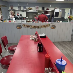 a red table and chairs