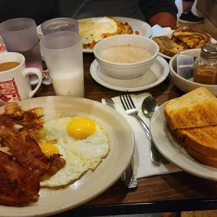 Sausage skillet, Sunnyside up eggs with potatoes and bacon, toast and oatmeal special