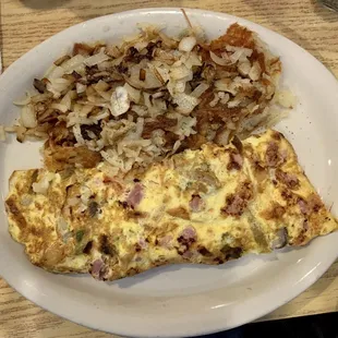 Omelette and hash browns with onions.