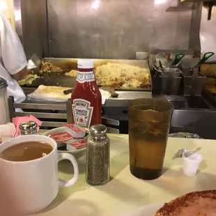 Sat and the counter and watched them make breakfast.
