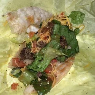 A nasty non seasoned, rubbery beef taco. All you can taste is pepper. WHO puts pepper in taco meat?