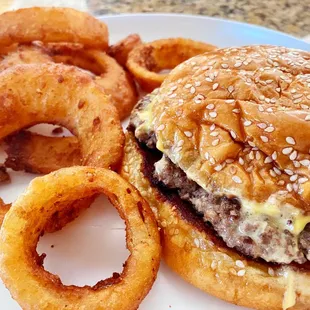 Single Cheeseburger with fried onions and onion rings