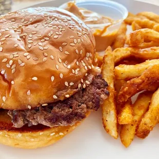 Single Hamburger with fried onions, fries with cajun seasoning and a side of spicy mayo