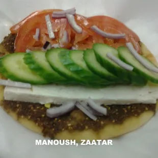 manoushi.feta cheese.tomato.cucumber.red onions