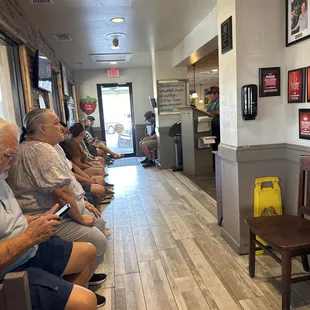 a line of diners waiting for a meal