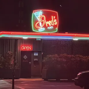 a neon sign for a restaurant
