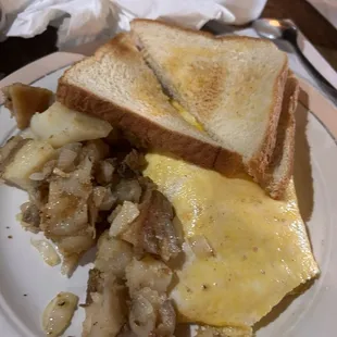 Egg and cheese omelette, toast, and potatoes