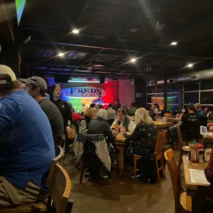 a crowd of people sitting at tables