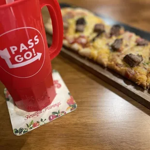 Pass Go signature drink and keeper cup.