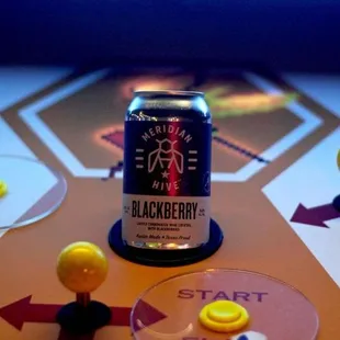 a can of blackberry on a table