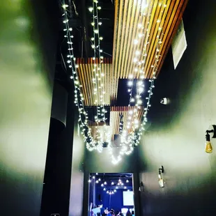 a group of people walking down a hallway