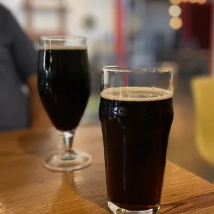two glasses of beer on a table