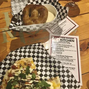 Tasty chicken BBQ flatbread+ that delicious pretzel with queso. The trailer was slingin' tasty treats at Iron Monk Brewery. Jan 2019