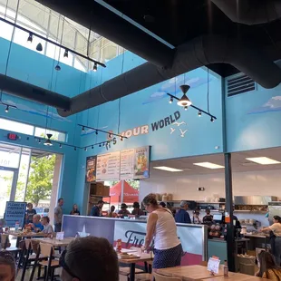 customers in a restaurant with blue walls