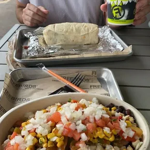 a woman eating a burrito