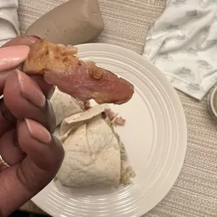 Close up of raw chicken in burrito