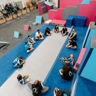 Group warm up at Freedom in Motion parkour gym