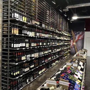 A custom wine wall 12' high and 30' long with a library ladder that holds over 4400 bottles of wine!