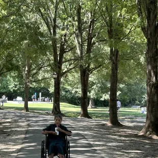 My Mom, Cleopatra, is enjoying a strawberry shake while I push her through the park to enjoy the beauty of Freedom Park!