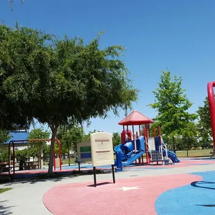 Notice the MISSING Swings on the right that should be hanging and the black POTHOLES on the ground