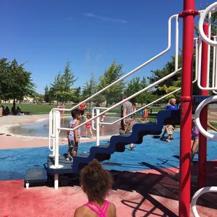 Play ground was wet and the kids that were dry definitely got wet when going down the slide
