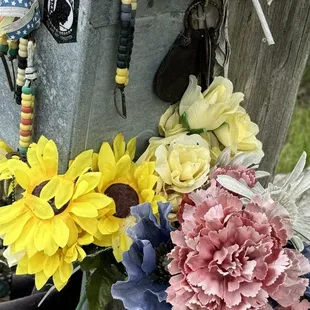 A light pole at the Freedom Rock.  A lot of people leave mementos here.