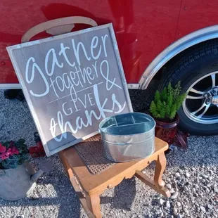 a bucket of water and a sign