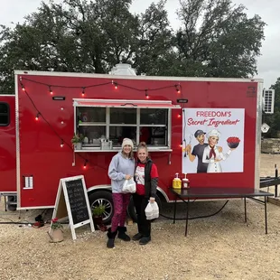 Owner posing with the customers!