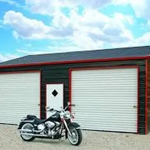 a motorcycle parked in front of a garage