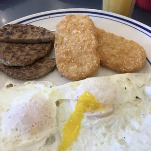 Two eggs over easy with turkey sausage &amp; hash browns