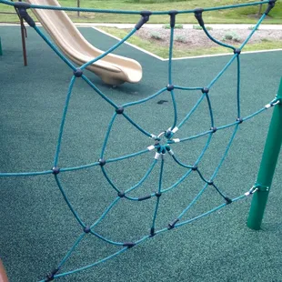 Spider web rope climbing structure