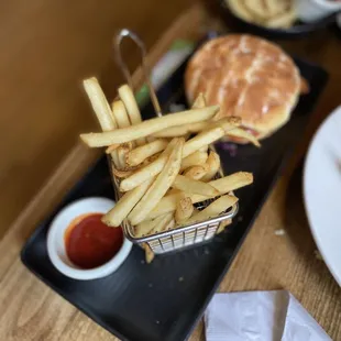 a plate of french fries and a burger