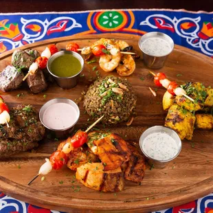 Assortment of Skewers and Freekeh