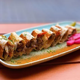 Beef &amp; Lamb Shawarma Shrak: Spiced beef &amp; lamb w/ tomatoes, red onions, house tahini sauce | $18