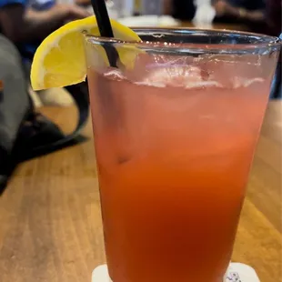a drink with a slice of lemon