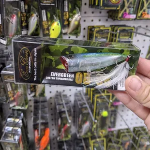 a person holding a fishing lure