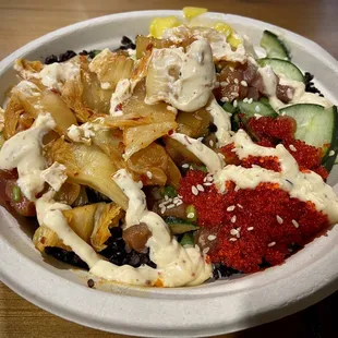 a bowl of mixed vegetables and sauce